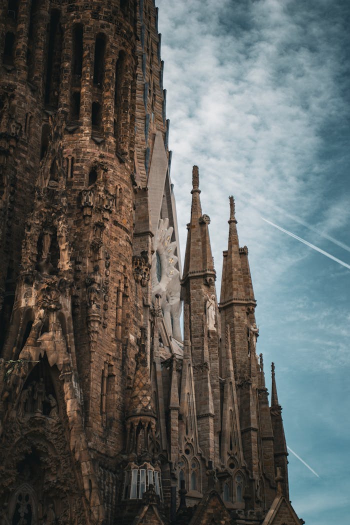 Close-up of the stunning Sagrada Familia showcasing gothic architecture under a vibrant sky.