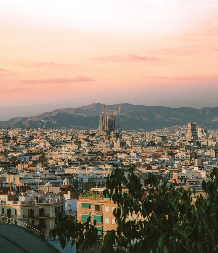 A breathtaking aerial view of Barcelona with Sagrada Familia at sunset.
